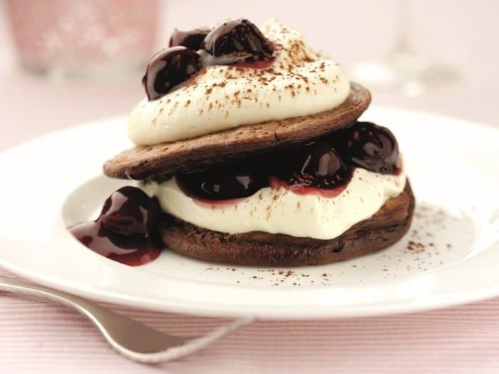 A piece of cake on a plate, with Chocolate and Pancake