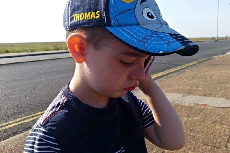 A little boy wearing a hat