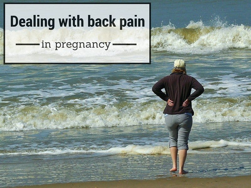 A person standing on a beach next to the ocean