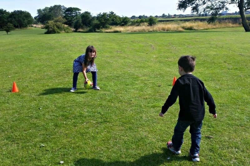 A young boy in a green field