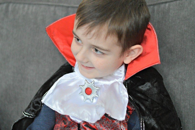 A little boy wearing a suit and tie