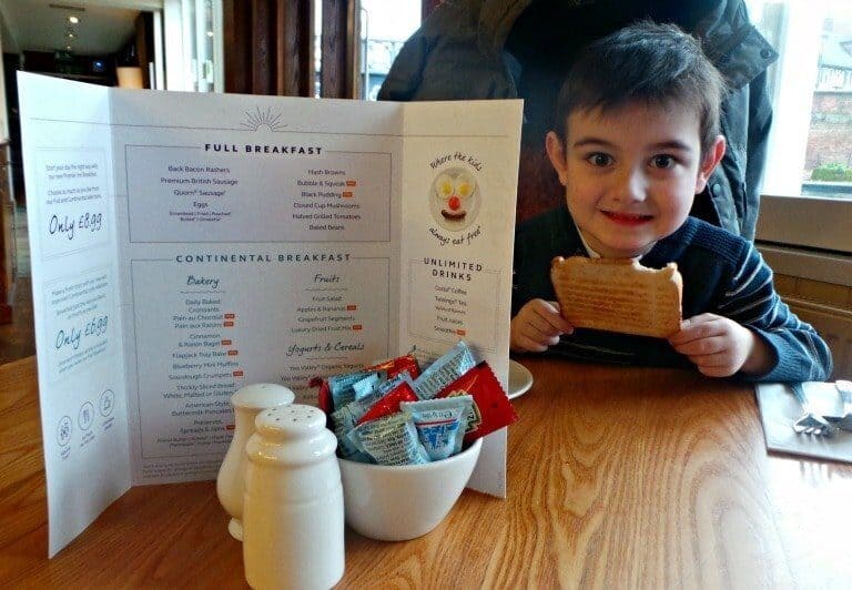 A little boy sitting at a table