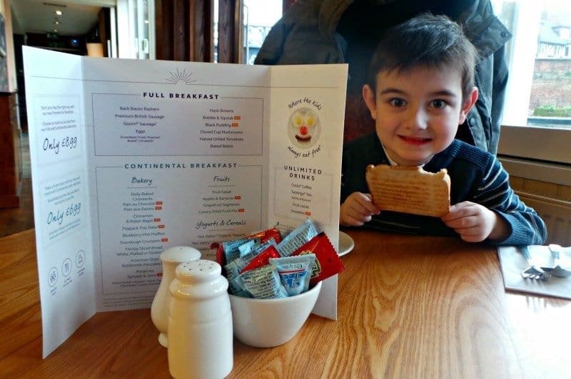 A little boy sitting at a table