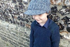 A young boy wearing a hat