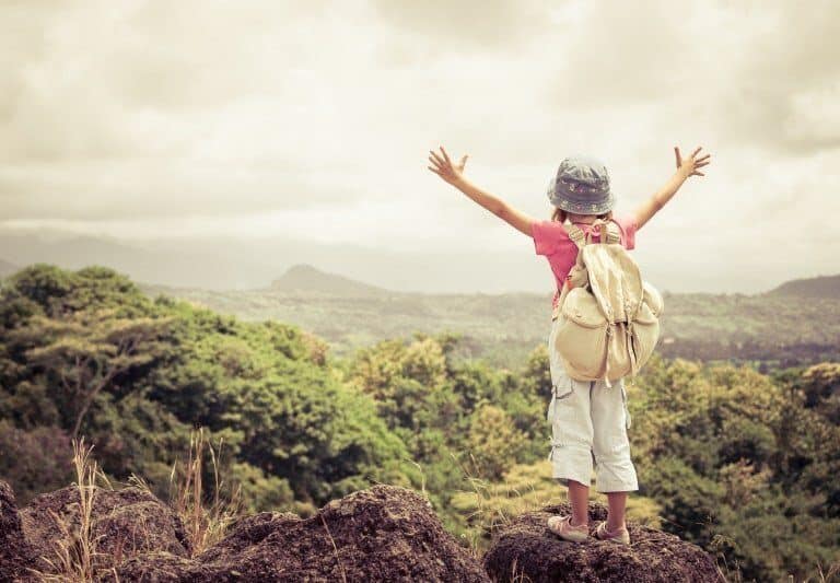 A man standing on top of a hill