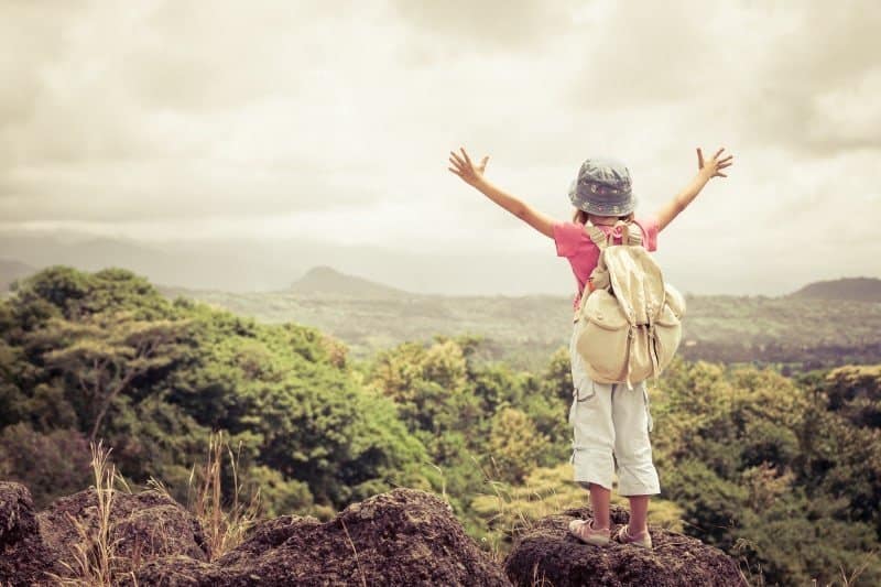 A man standing on top of a hill