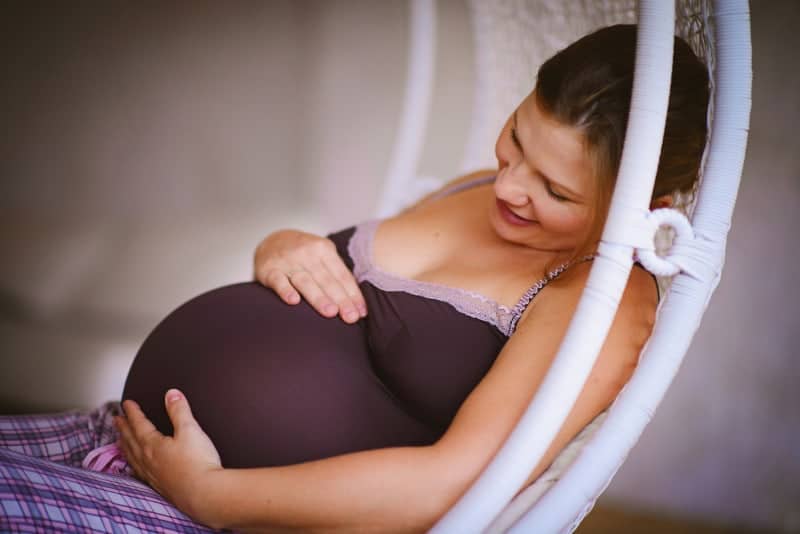 A woman holding a baby