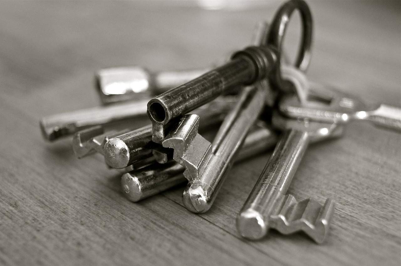 A close up of a key on a wooden surface