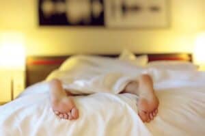 A baby lying on a bed