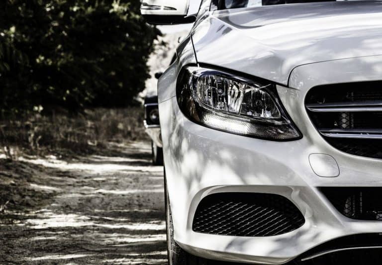 A car parked in front of a mirror posing for the camera