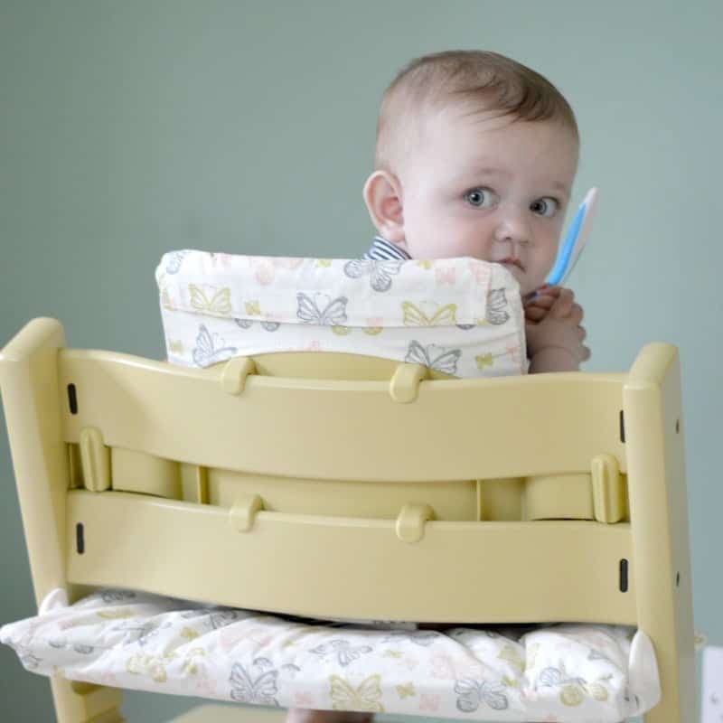 A baby sitting on a table