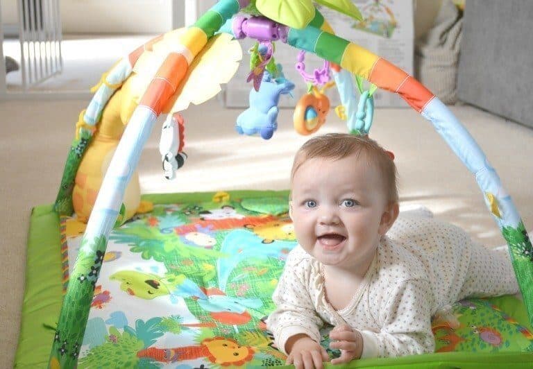 A baby holding a stuffed toy