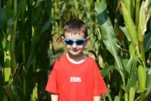 A young boy wearing sunglasses