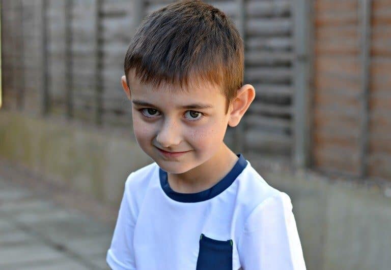 A young boy in a blue shirt