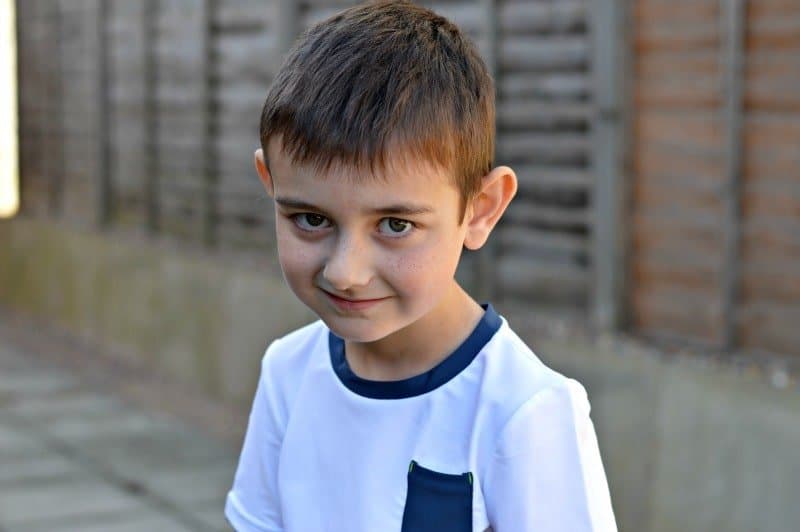 A young boy in a blue shirt