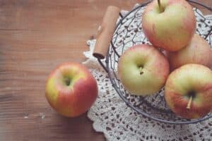 An apple sitting on top of a wooden table