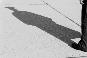 A person standing on a sidewalk