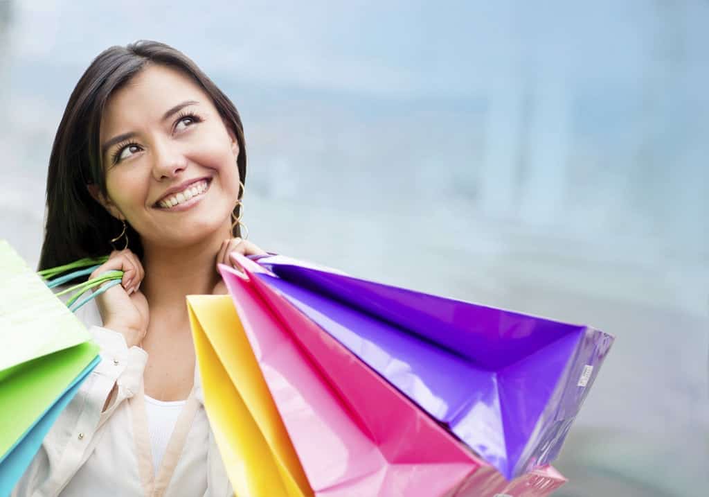 A woman holding a colorful umbrella