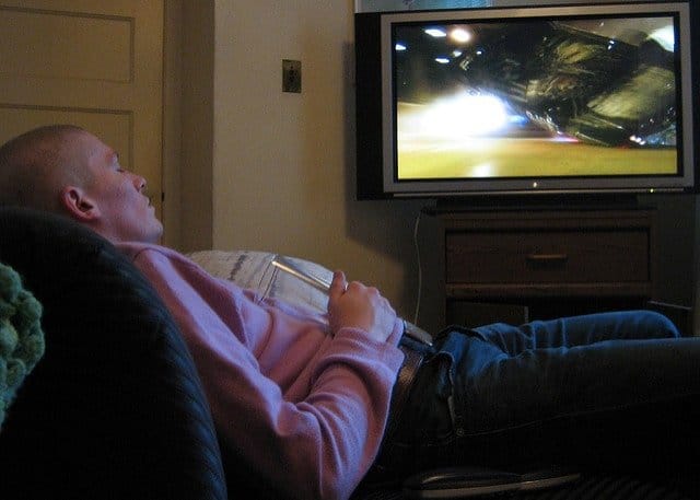 A person sitting on a bed