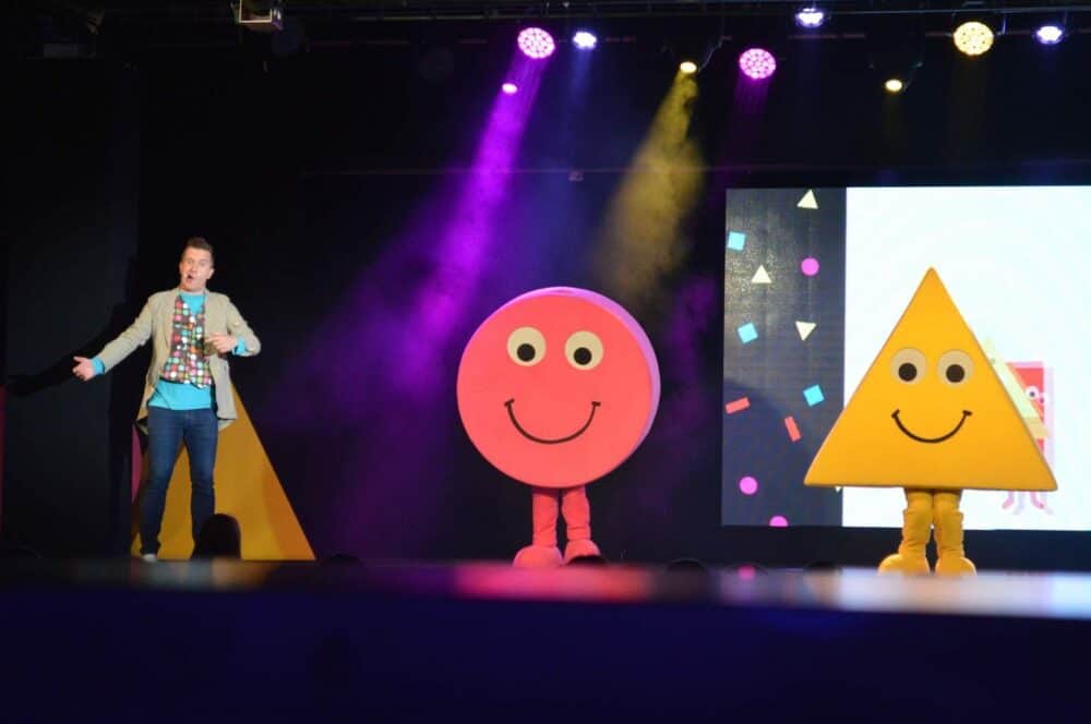 A person standing in front of a stage