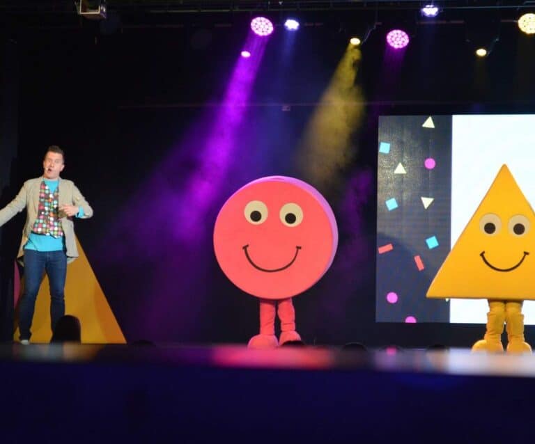 A person standing in front of a stage