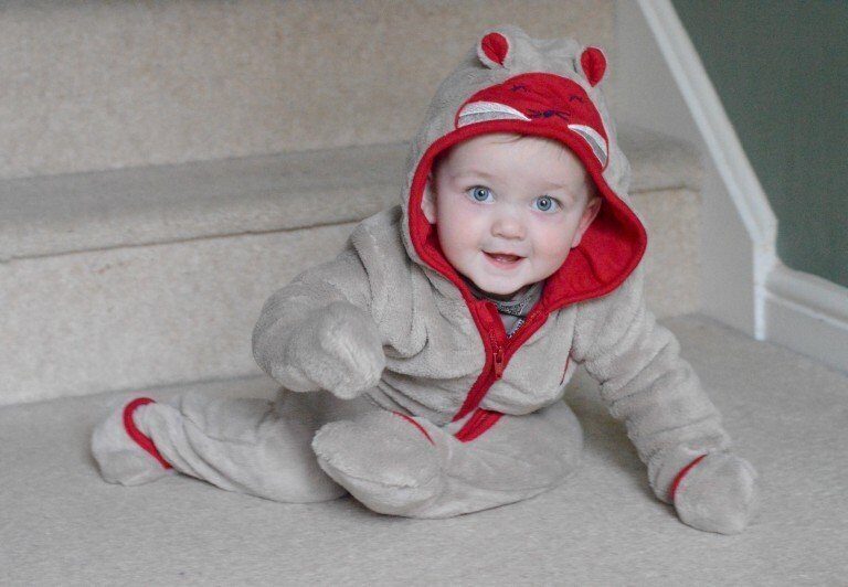 A little boy wearing a hat