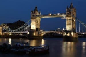 A large bridge lit up at night