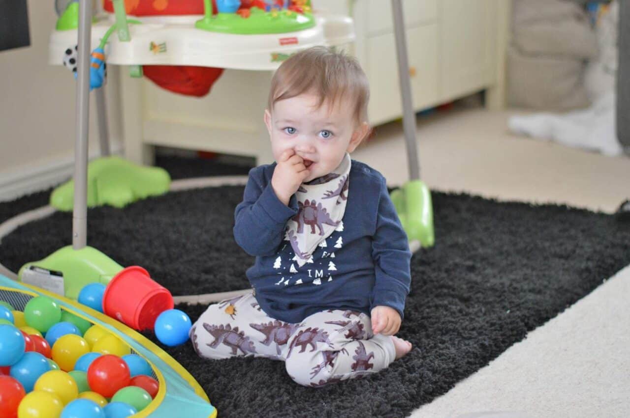 A small child sitting on a table