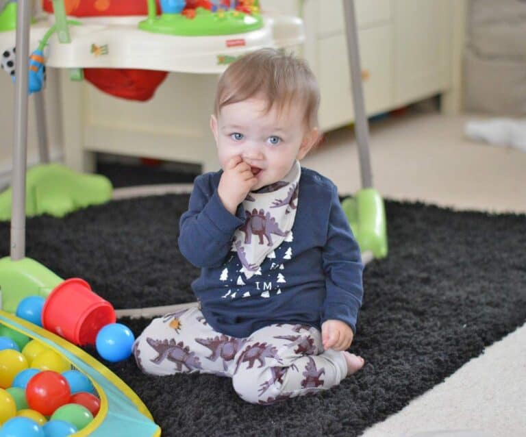 A small child sitting on a table