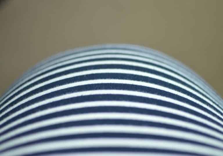 A close up of a person in a striped shirt