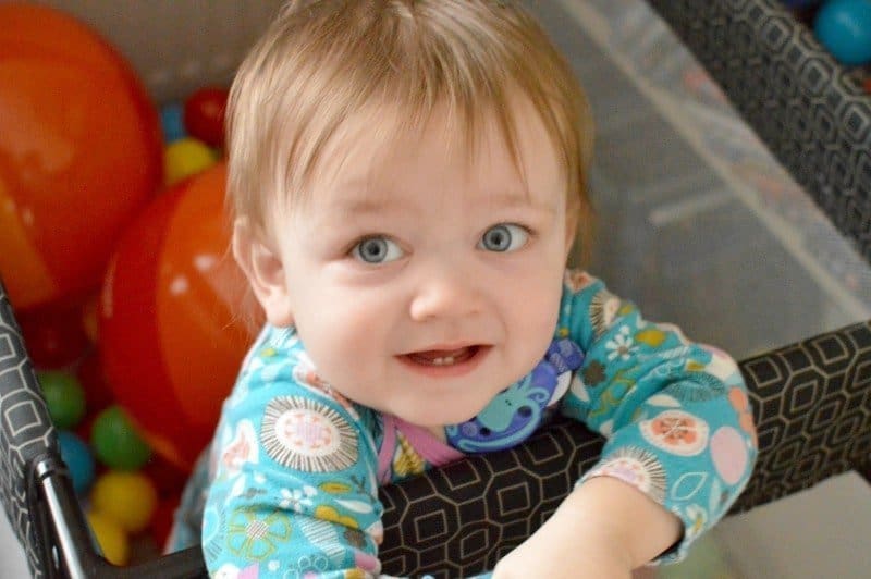 A small child sitting on a table