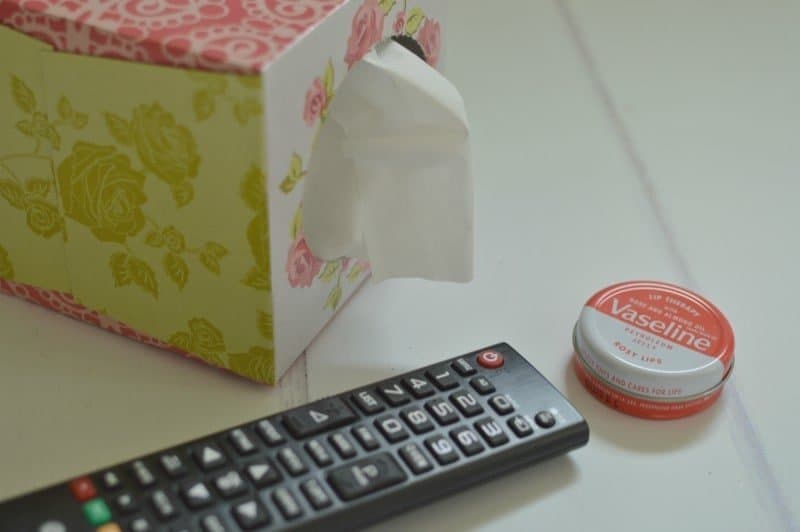 A remote control sitting on top of a table