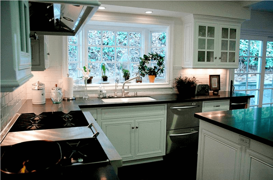 A kitchen with a sink and a window