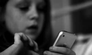 A close up of a person holding a cell phone