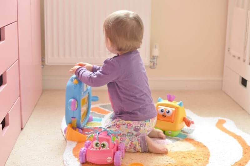 A little girl sitting on a table