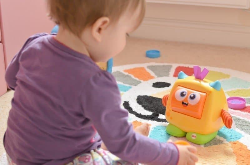 A small child sitting on a table