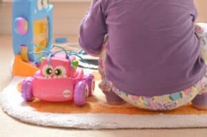 A little girl sitting on a table