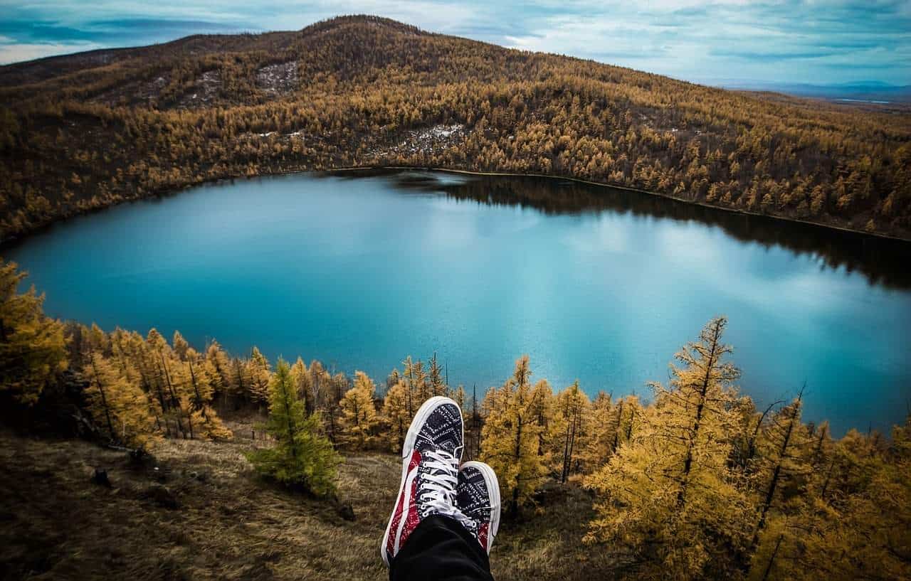 A close up of a hillside next to a body of water