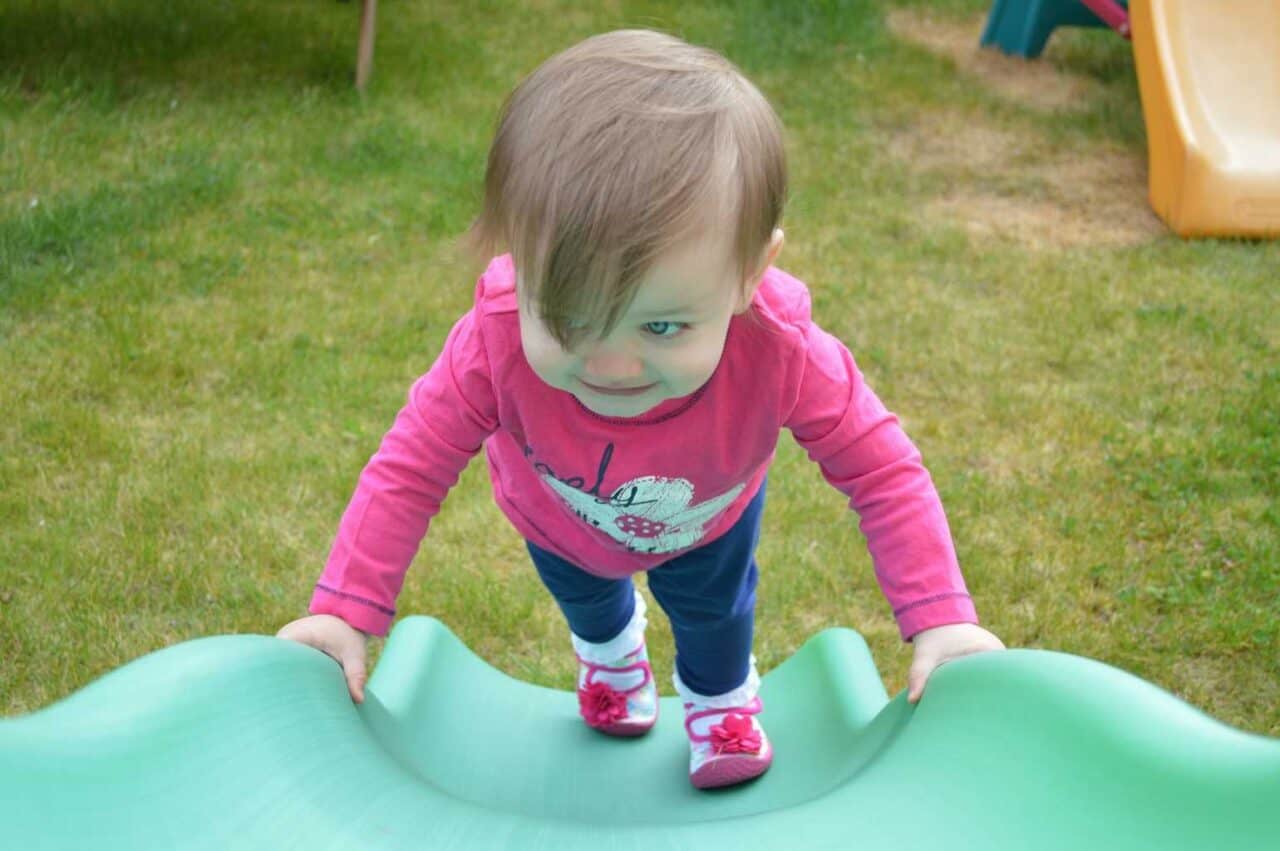 A small child sitting on a table