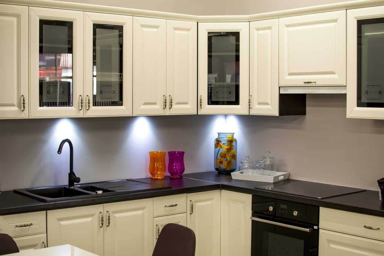 A kitchen with a sink and a microwave