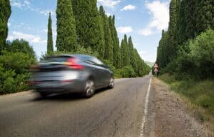 A close up of a car going down the road