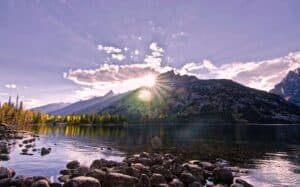 A large body of water with a mountain in the background