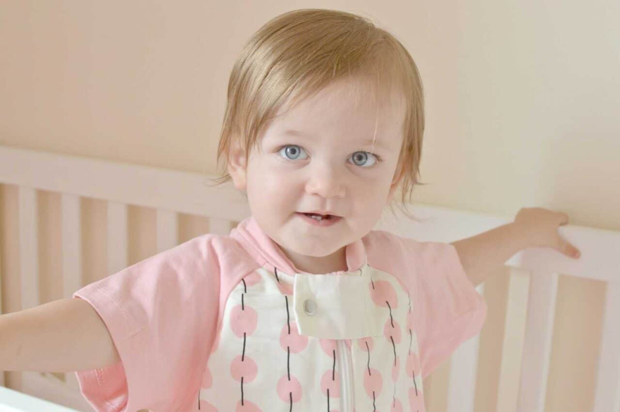 A little girl smiling at the camera