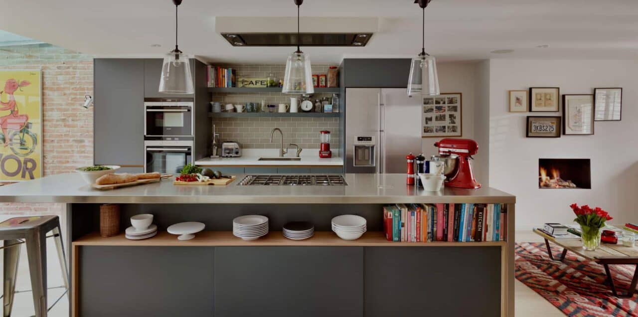 A room filled with furniture and vase of flowers on a kitchen counter