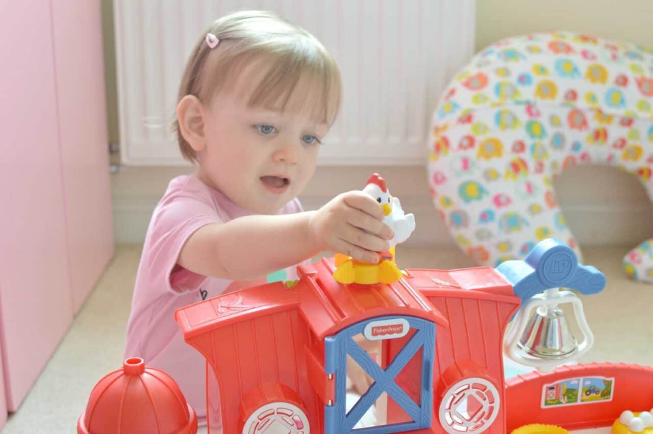 A small child sitting on a table