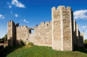 A stone castle next to a brick building