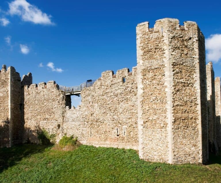 A stone castle next to a brick building