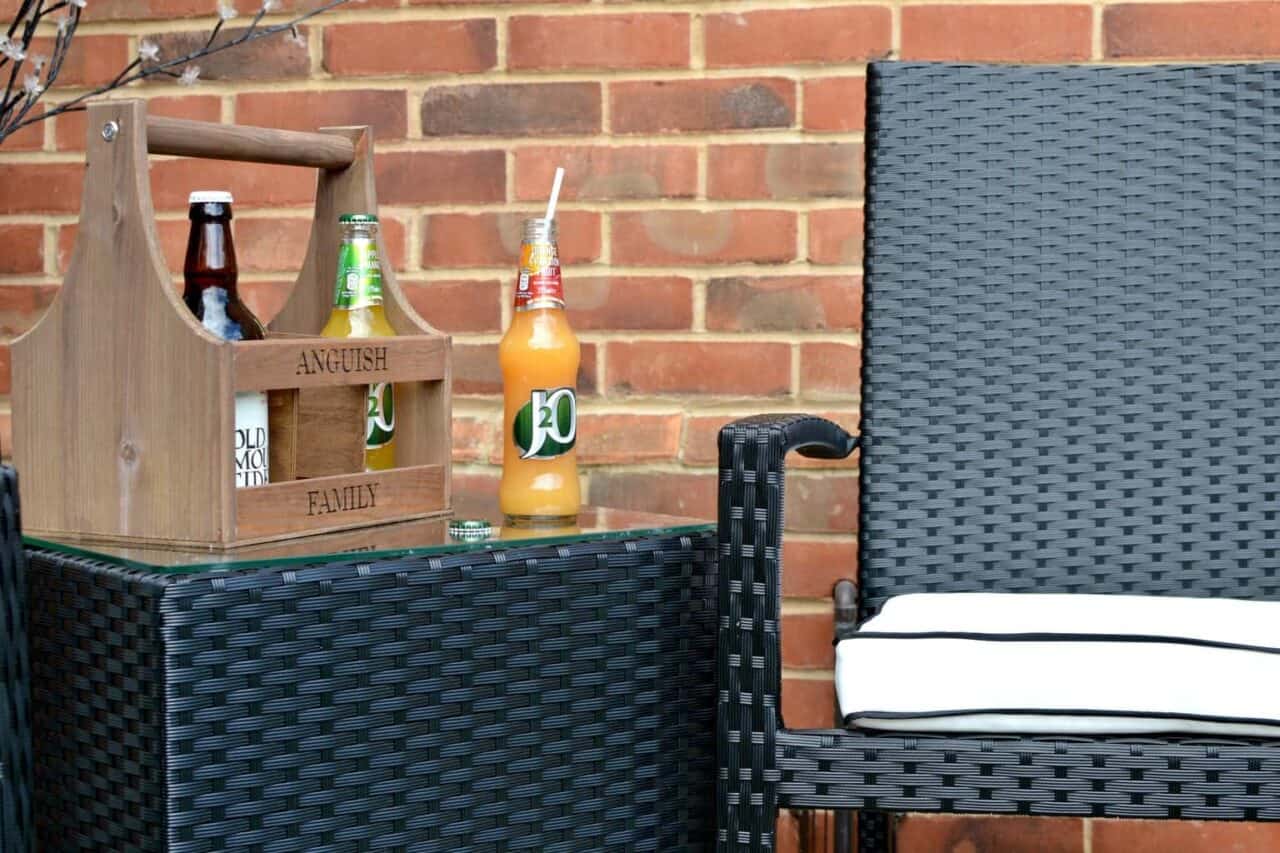 A chair sitting in front of a brick wall