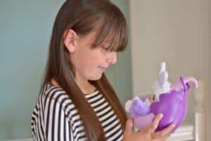 A woman wearing a purple shirt