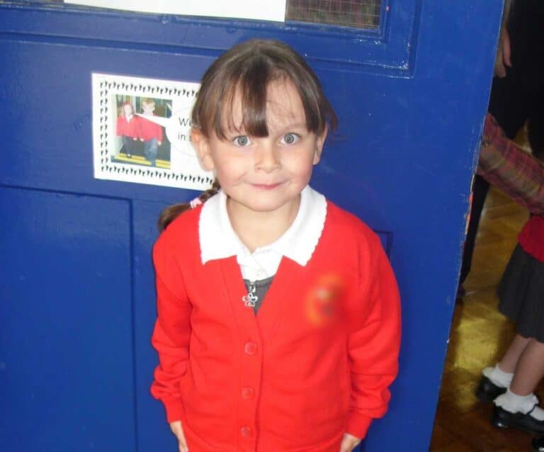 A little boy posing for a picture